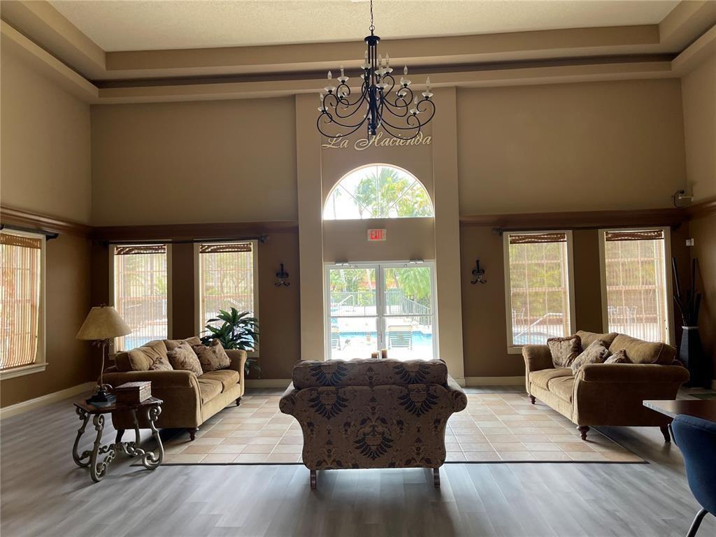 18338 Northwest 68th Avenue, Unit B Hialeah, FL 33015 - Photo 16 of 21 a living room with furniture and a large window