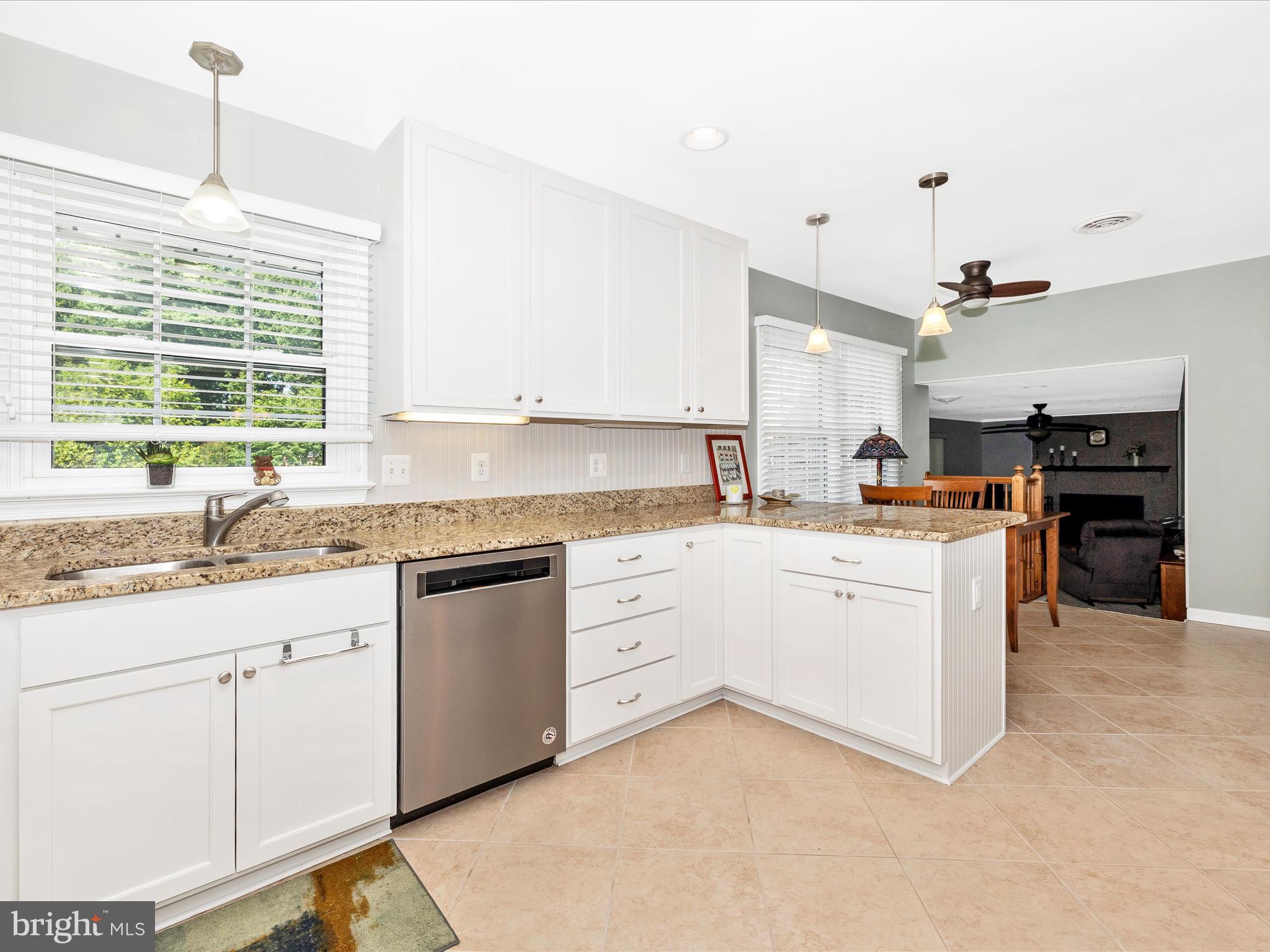 8102 Glendale Drive Frederick, MD 21702 - Photo 17 of 61 a kitchen with granite countertop white cabinets and white appliances
