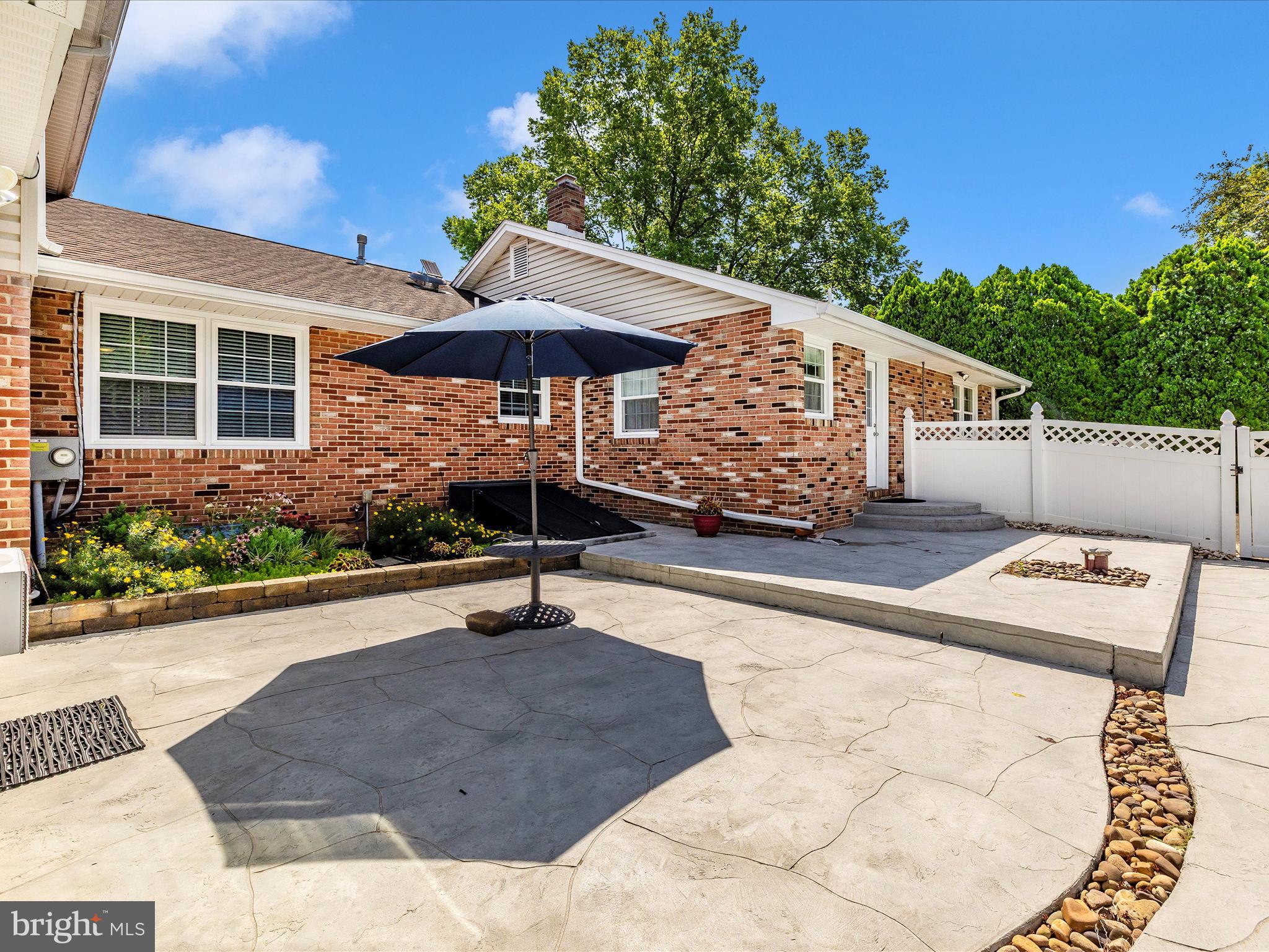 8102 Glendale Drive Frederick, MD 21702 - Photo 6 of 61 a view of a house with backyard sitting area and garden