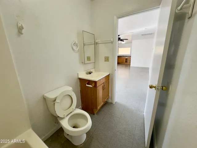 a bathroom with a toilet and a sink