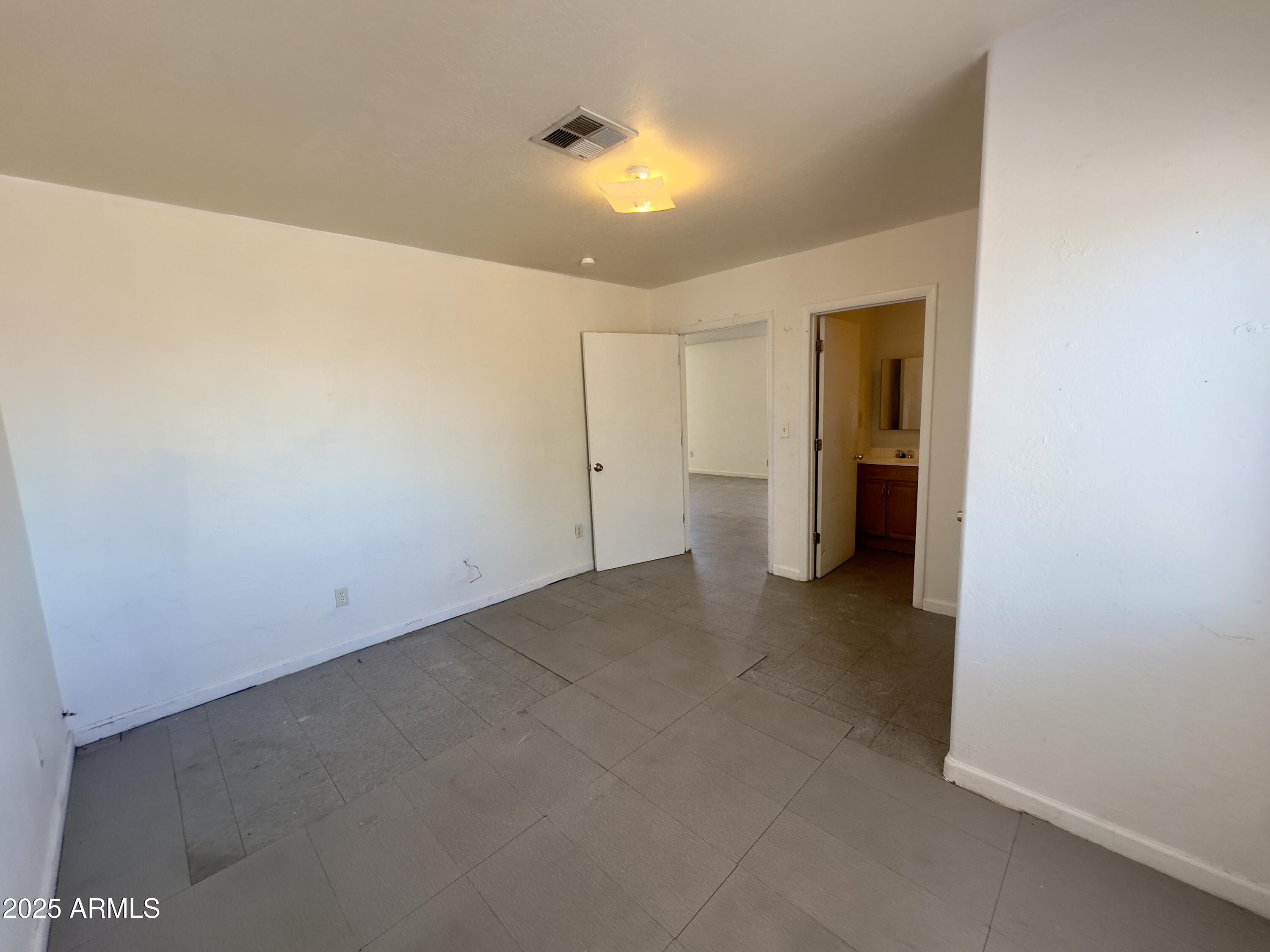 1228 East Apache Street, Unit 2 Phoenix, AZ 85034 - Photo 8 of 15 a view of a storage & utility room with a sink