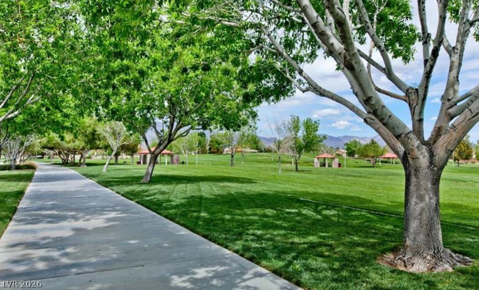 6405 North Raptor Court North Las Vegas, NV 89084 - Photo 56 of 66 Stroll through a vibrant green park, lined with mature trees and charming covered gazebos.