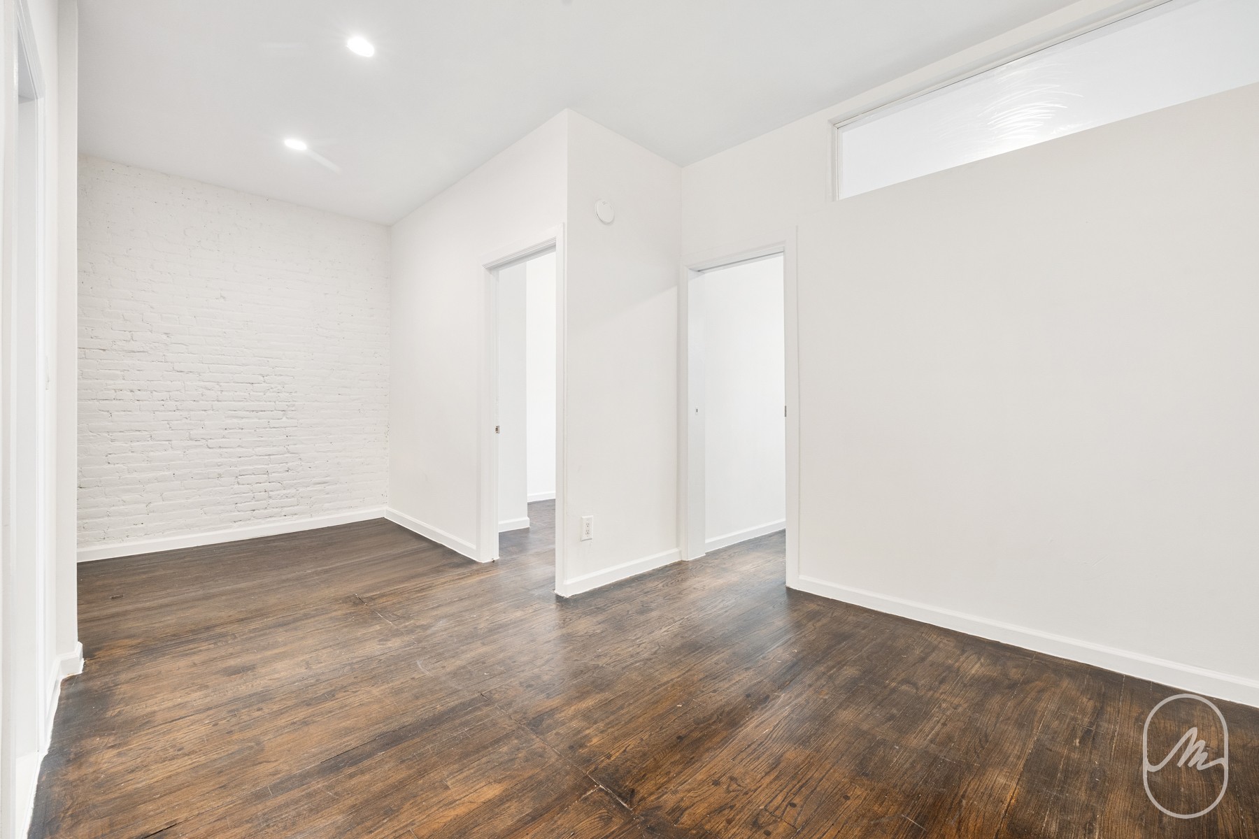 309 West 29th Street, Unit 2R Manhattan, NY 10001 - Photo 3 of 11 an empty room with wooden floor