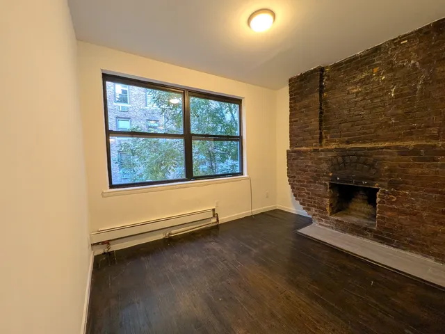 a bathroom with a bathtub sink and mirror
