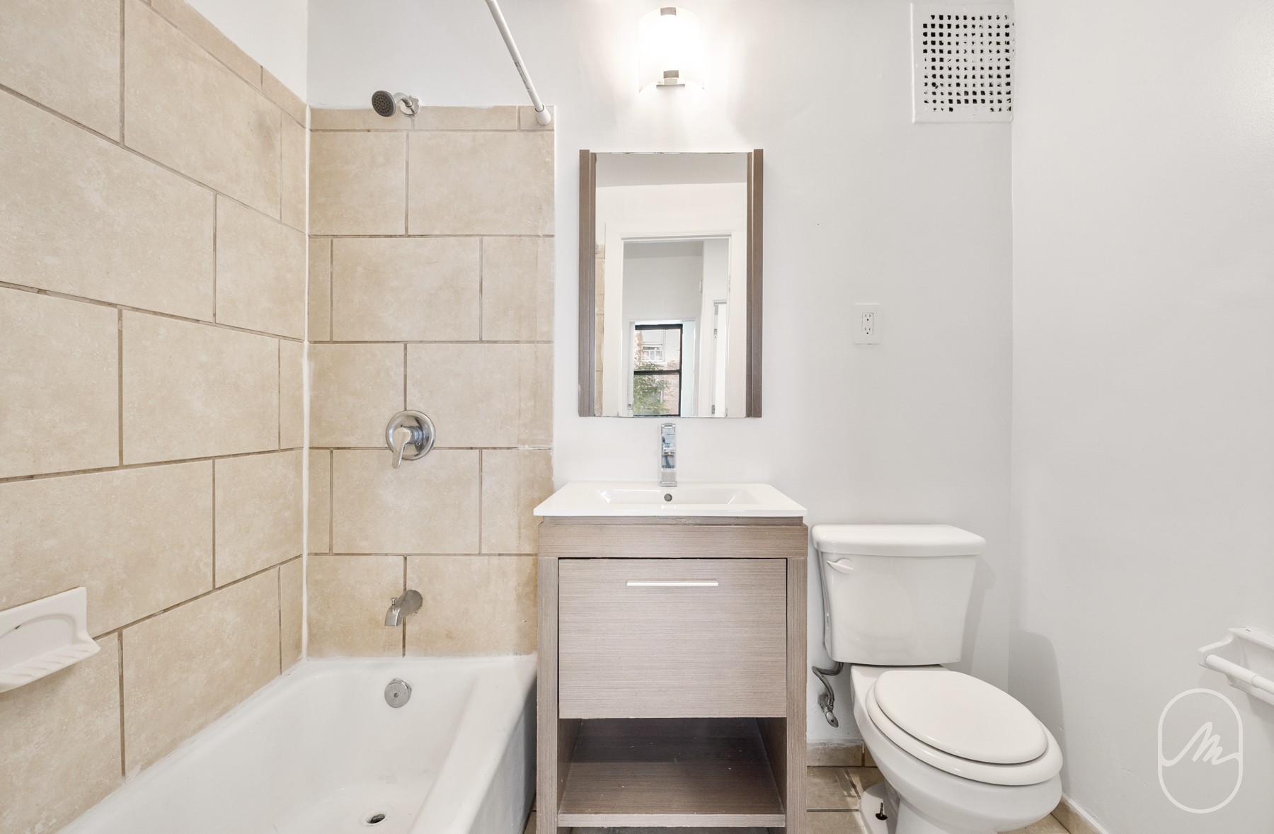 309 West 29th Street, Unit 2R Manhattan, NY 10001 - Photo 8 of 11 a bathroom with a sink a toilet and shower