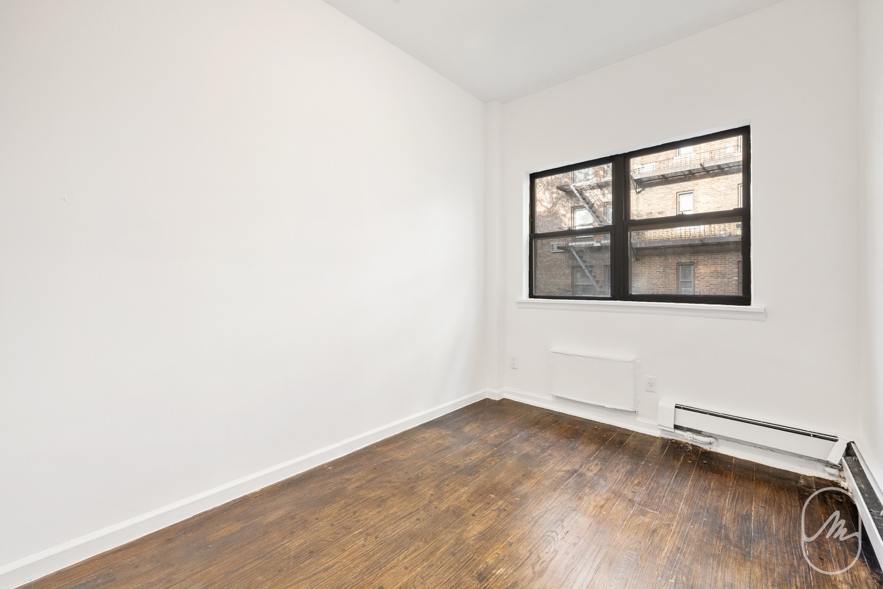 309 West 29th Street, Unit 2R Manhattan, NY 10001 - Photo 9 of 11 an empty room with a window