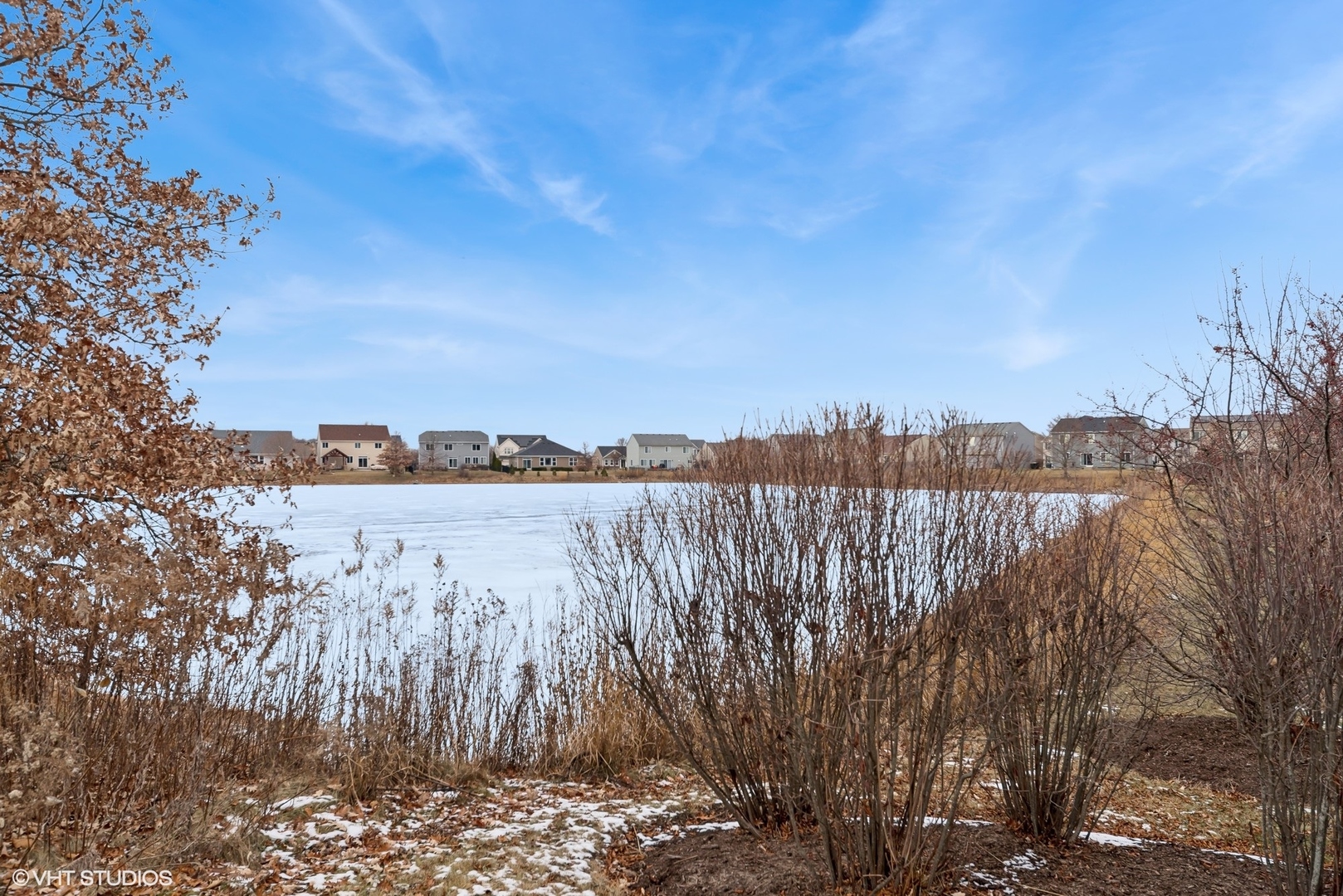 361 Minuet Circle Volo, IL 60073 - Photo 18 of 19 a view of a lake with houses in the back