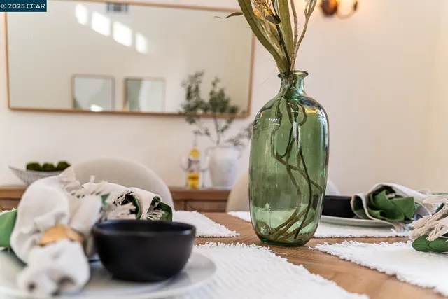 a dining table chair wooden floor and kitchen view