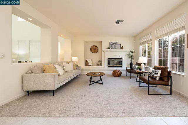a living room with furniture and a rug