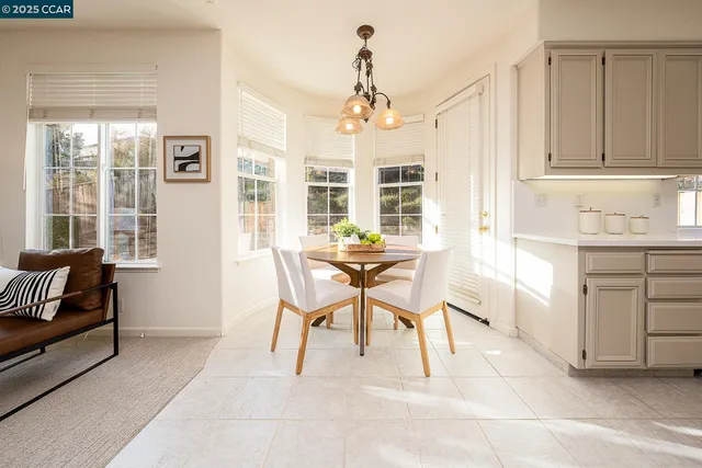 a kitchen with stainless steel appliances a stove a sink and a refrigerator
