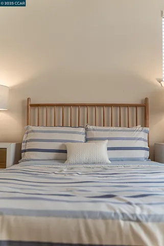 a white bath tub sitting next to a white sink and vanity