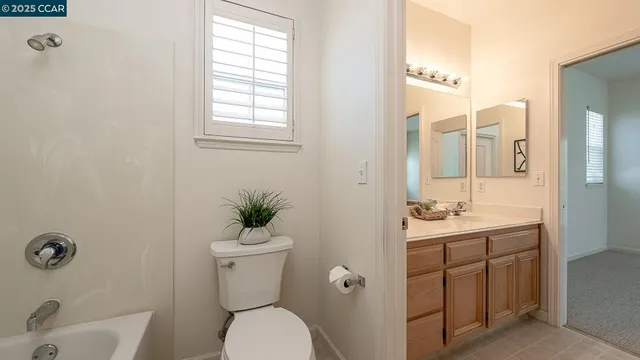 a spacious bedroom with a bed and a couch