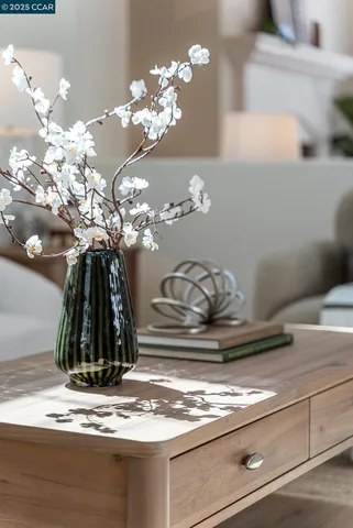 a view of a hallway with dining room and chandelier