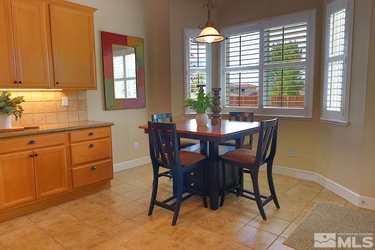 2845 Bull Rider Drive Reno, NV 89521 - Photo 8 of 39 a view of a dining room with furniture and window
