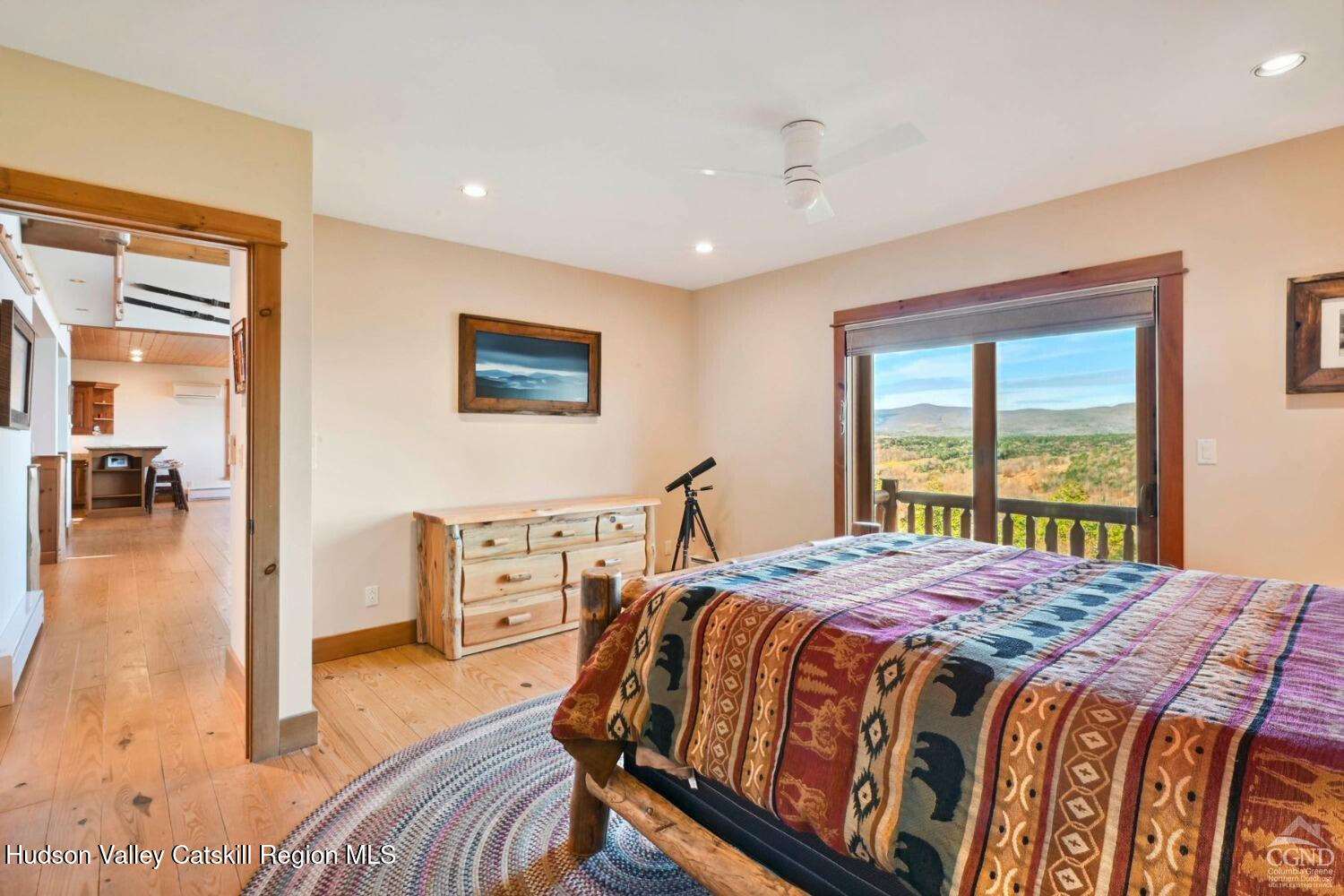 22 The Loop Windham, NY 12496 - Photo 17 of 64 a bedroom with a bed and wooden floor