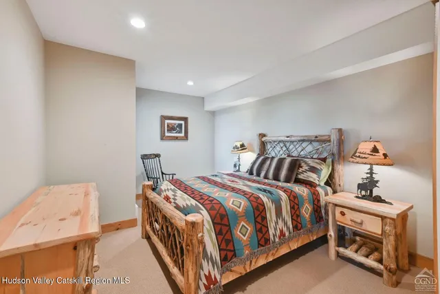 a bedroom with furniture and a window