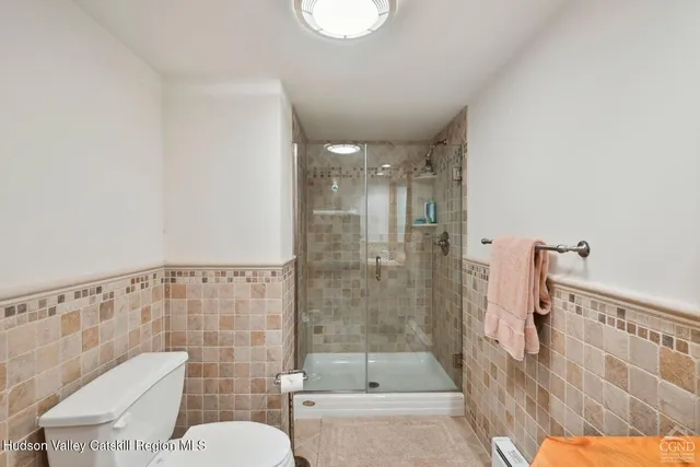 a view of living room with furniture and a chandelier