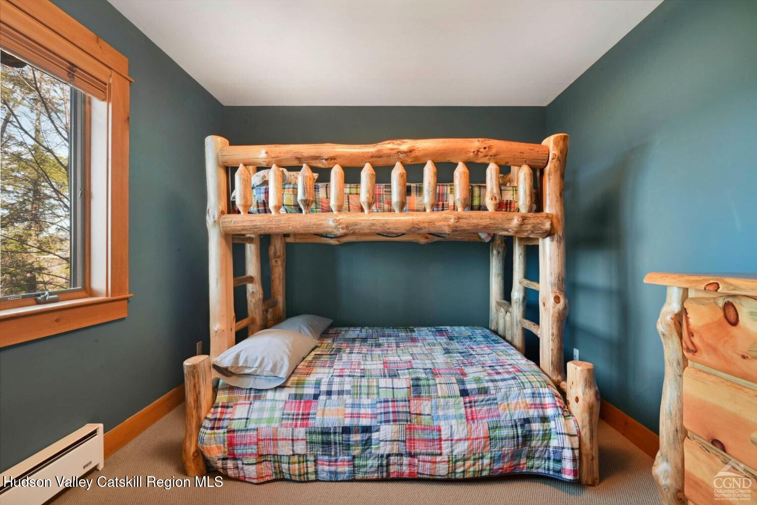 22 The Loop Windham, NY 12496 - Photo 40 of 64 a bedroom with a bed and a window