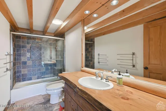 a view of a balcony with a yard