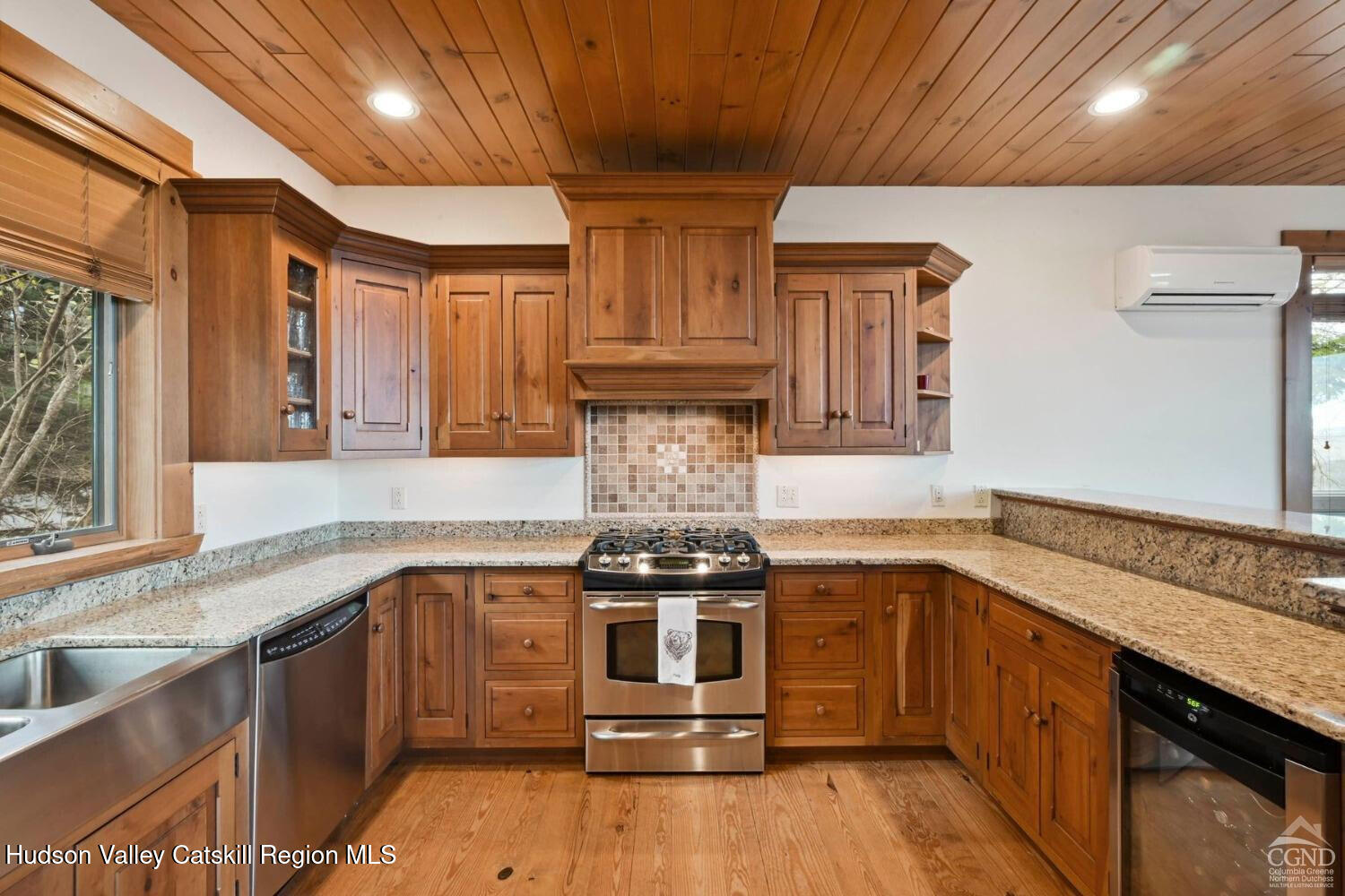 22 The Loop Windham, NY 12496 - Photo 10 of 64 a kitchen with stainless steel appliances granite countertop a stove and a sink