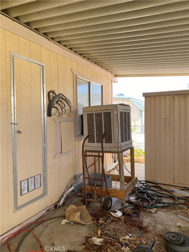 20683 Waalew Road, Unit B161 Apple Valley, CA 92307 - Photo 28 of 30 Covered Carport and Condenser Unit with Storage Shed