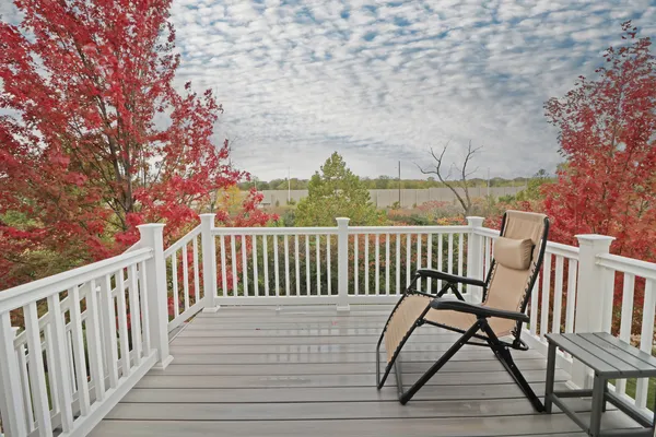 a view of a chairs on wooden deck