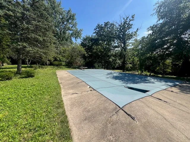 a view of a large yard with large trees