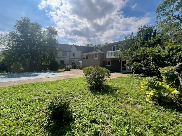 a backyard of a house with lots of green space
