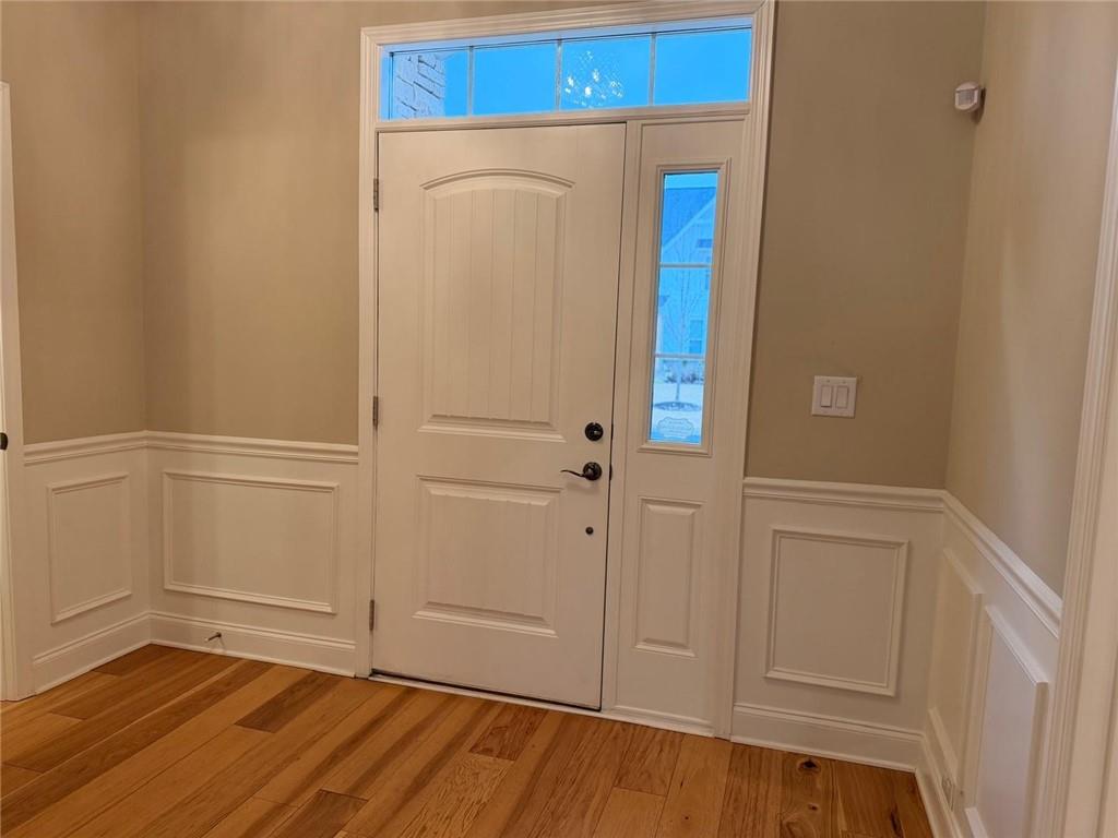 8040 Scenic Ridge Way Ball Ground, GA 30107 - Photo 3 of 35 a view of an entryway with wooden floor