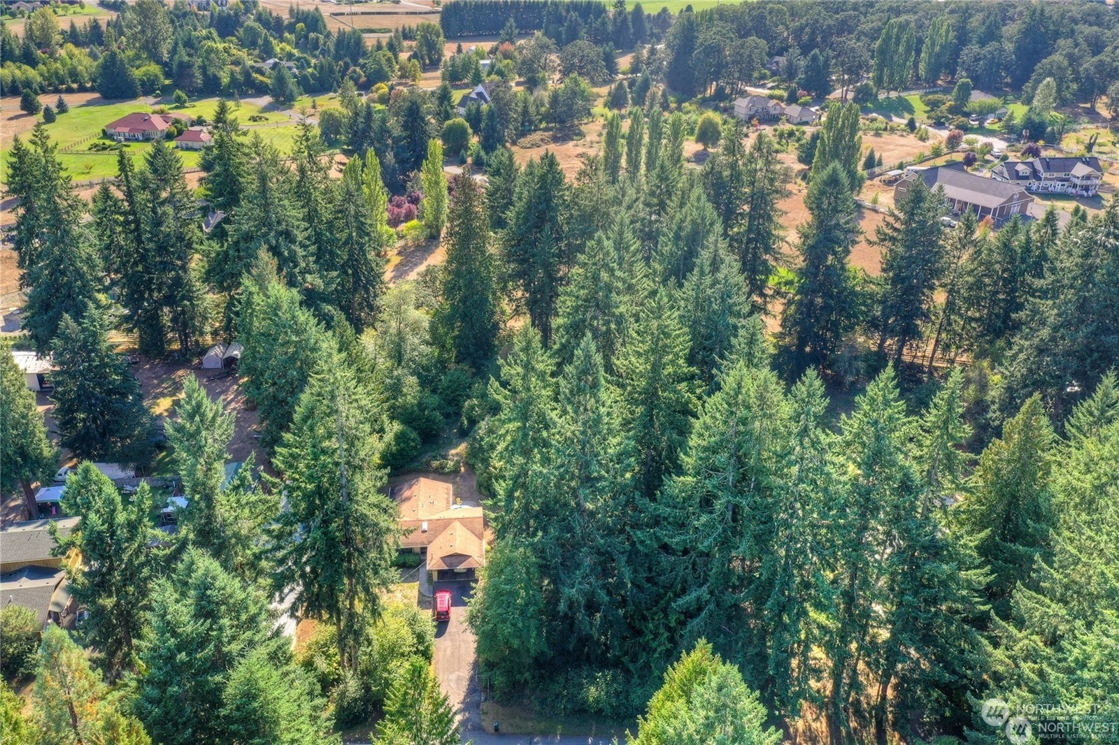 7349 Fair Oaks Road Southeast Olympia, WA 98513 - Photo 4 of 6 an aerial view of house with yard and outdoor seating