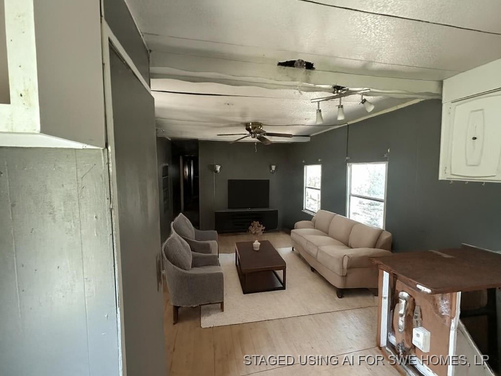 3 Quail Loop Belton, TX 76513 - Photo 6 of 12 a living room with furniture and a flat screen tv