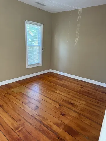 a view of an empty room with windows