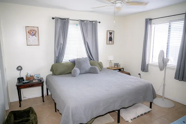 a bedroom with a bed and a window