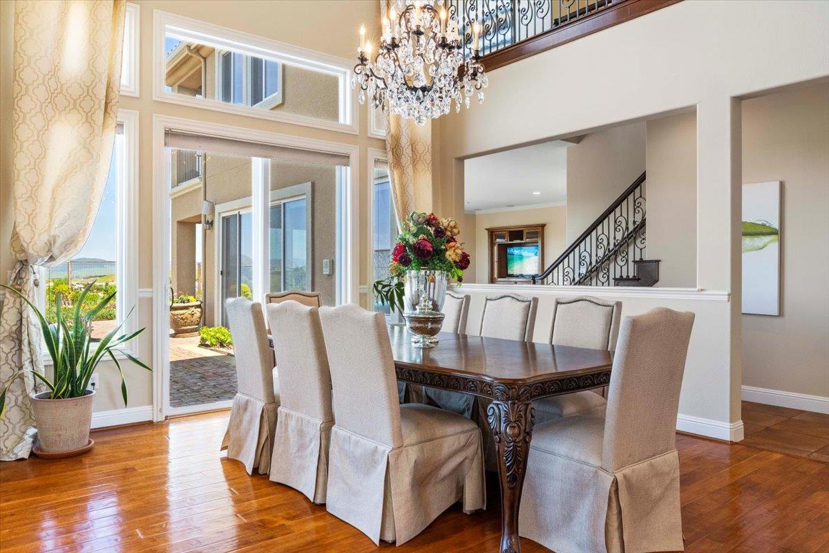 953 Winsford Court San Ramon, CA 94583 - Photo 14 of 73 a view of a dining room with furniture wooden floor and chandelier