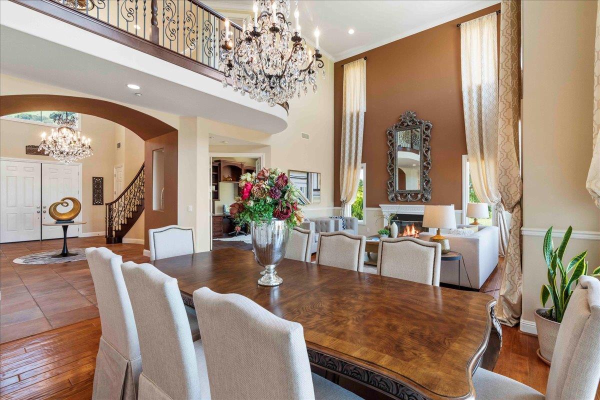 953 Winsford Court San Ramon, CA 94583 - Photo 15 of 73 a view of a dining room with furniture a chandelier and wooden floor