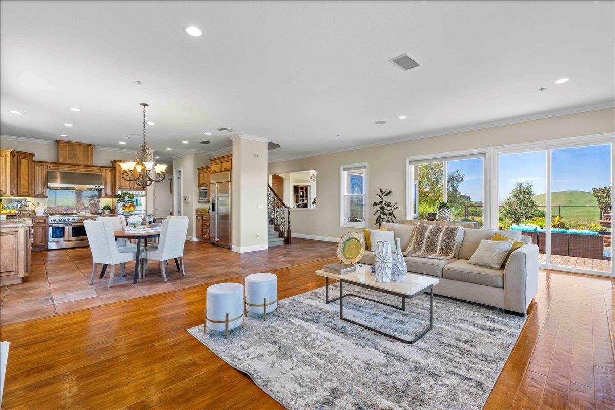 953 Winsford Court San Ramon, CA 94583 - Photo 16 of 73 a living room with furniture and a dining table with wooden floor