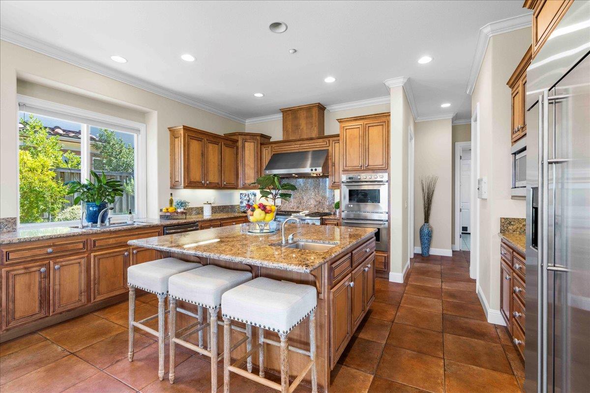953 Winsford Court San Ramon, CA 94583 - Photo 22 of 73 a kitchen with stainless steel appliances granite countertop a refrigerator and a stove top oven