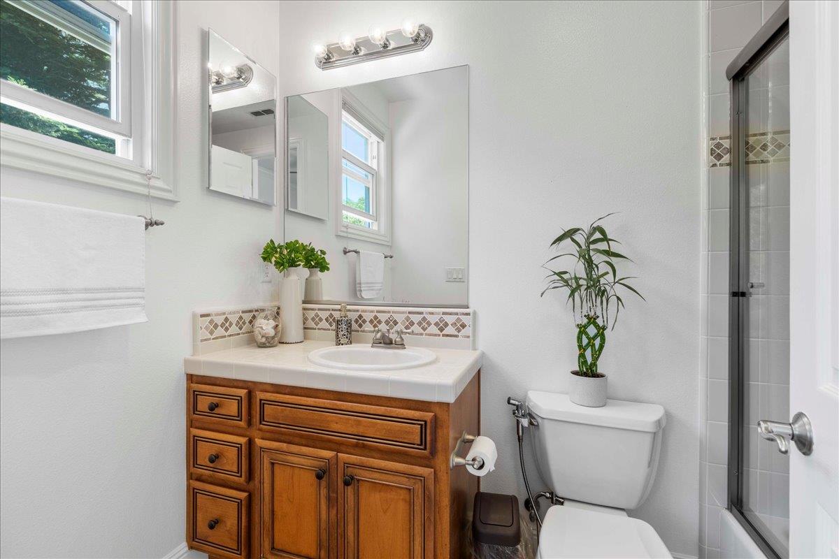 953 Winsford Court San Ramon, CA 94583 - Photo 27 of 73 a bathroom with a toilet sink and mirror