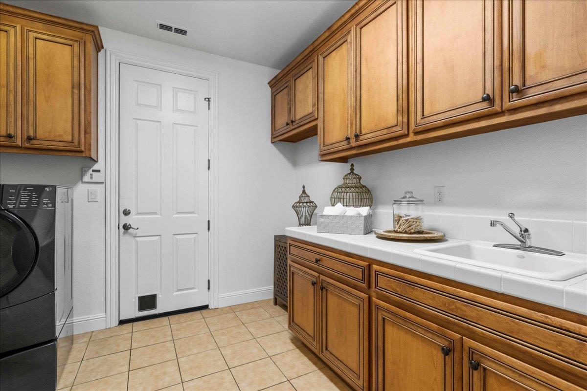 953 Winsford Court San Ramon, CA 94583 - Photo 29 of 73 a kitchen with stainless steel appliances granite countertop a sink a stove cabinets and a refrigerator