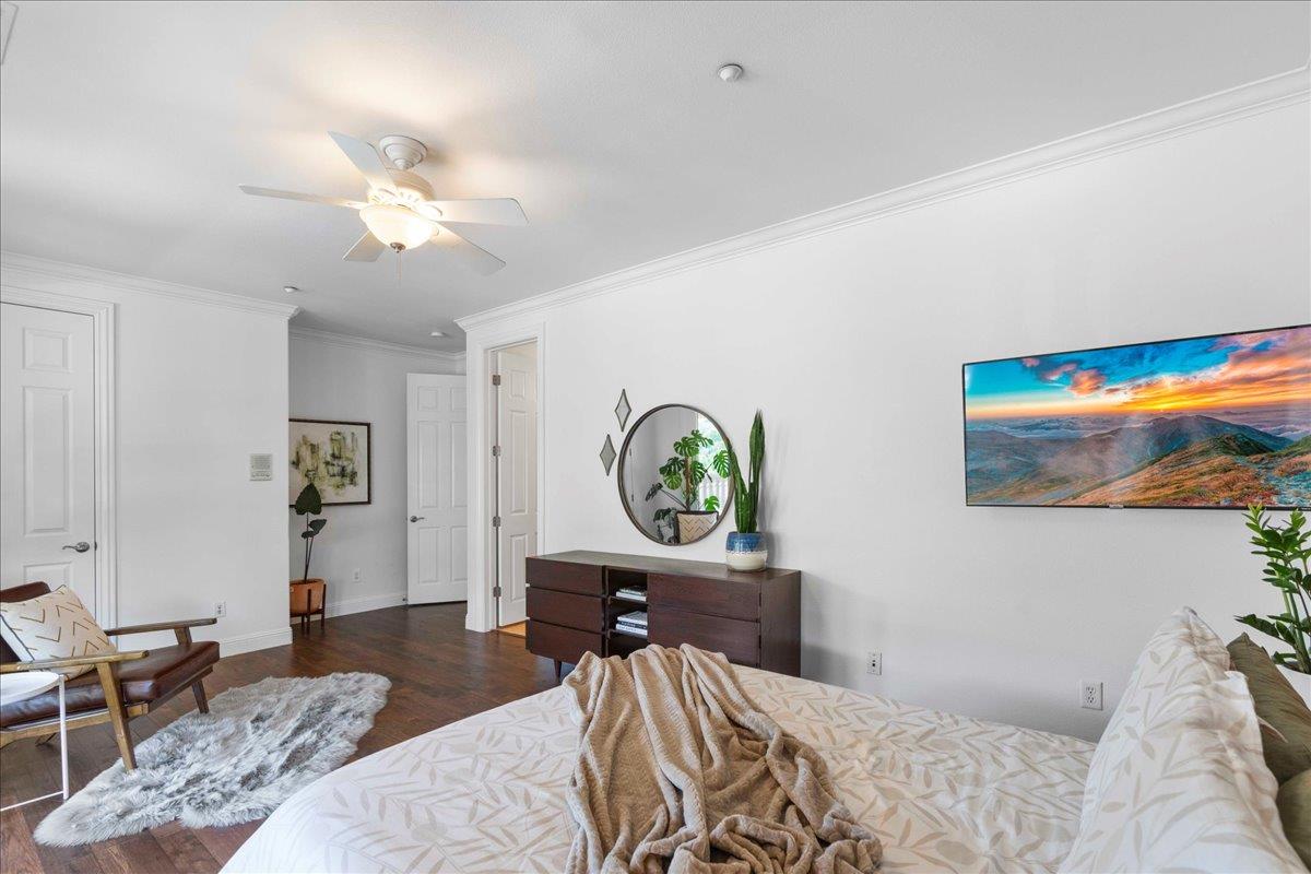 953 Winsford Court San Ramon, CA 94583 - Photo 48 of 73 a bedroom with a bed and a chandelier