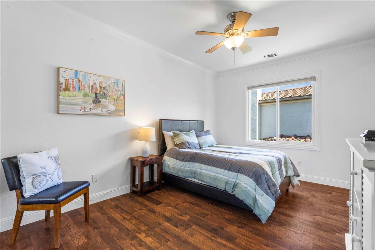 953 Winsford Court San Ramon, CA 94583 - Photo 52 of 73 a bedroom with a bed and a chandelier