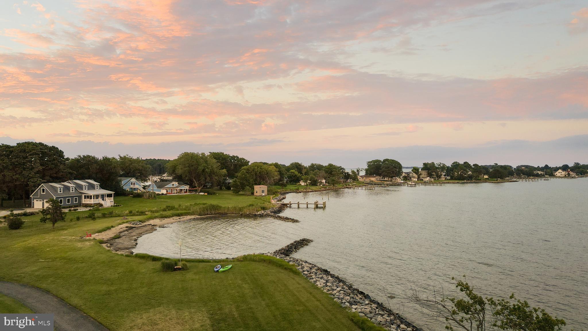 2554 Hoopers Island Road Fishing Creek, MD 21634 - Photo 13 of 85 a view of a lake with houses in the back