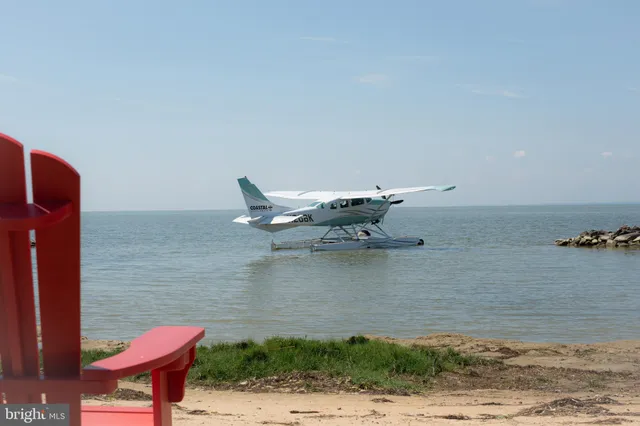 a dining room with furniture window and wooden floor