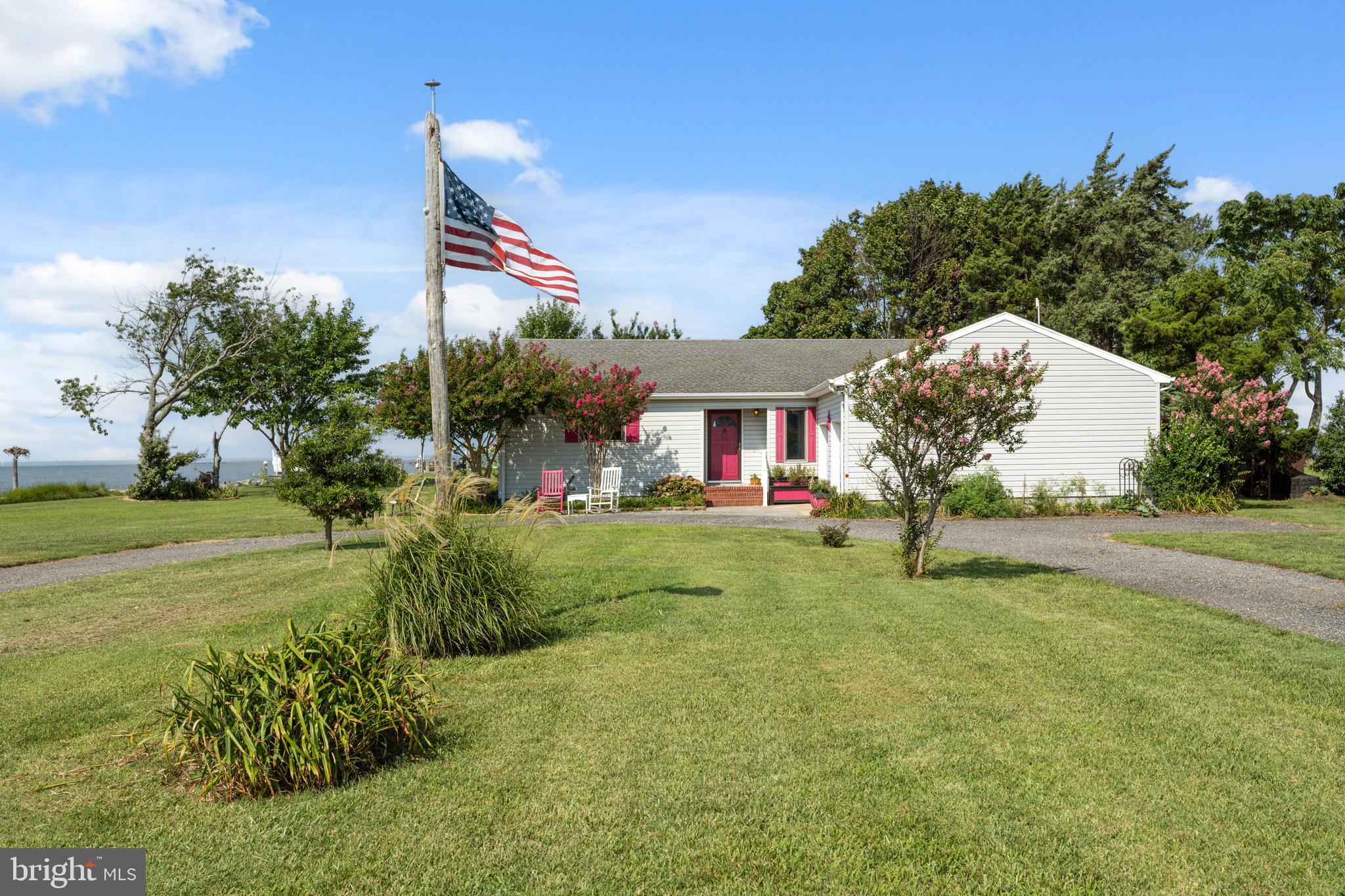 2554 Hoopers Island Road Fishing Creek, MD 21634 - Photo 16 of 85 a view of a house with a yard