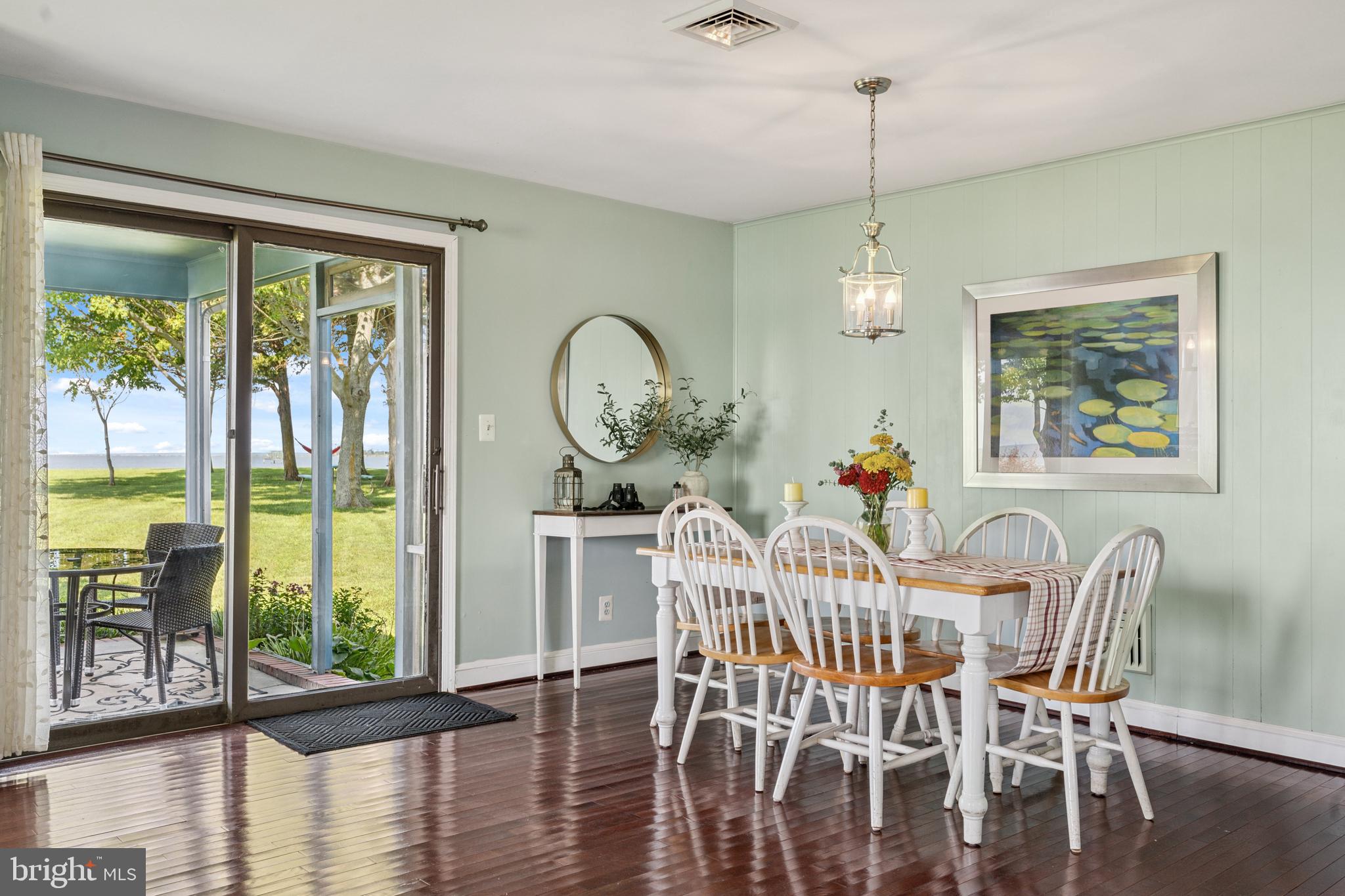 2554 Hoopers Island Road Fishing Creek, MD 21634 - Photo 21 of 85 a view of a dining room with furniture window and wooden floor
