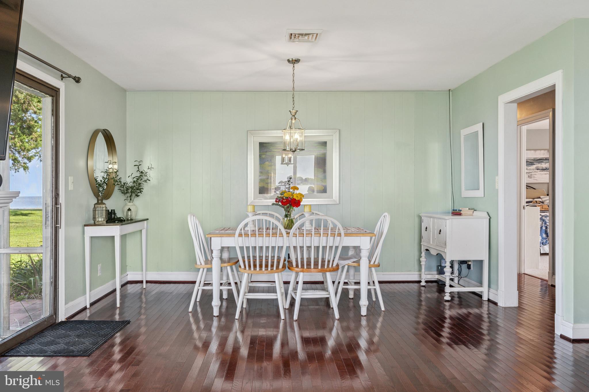2554 Hoopers Island Road Fishing Creek, MD 21634 - Photo 22 of 85 a dining room with furniture window and wooden floor