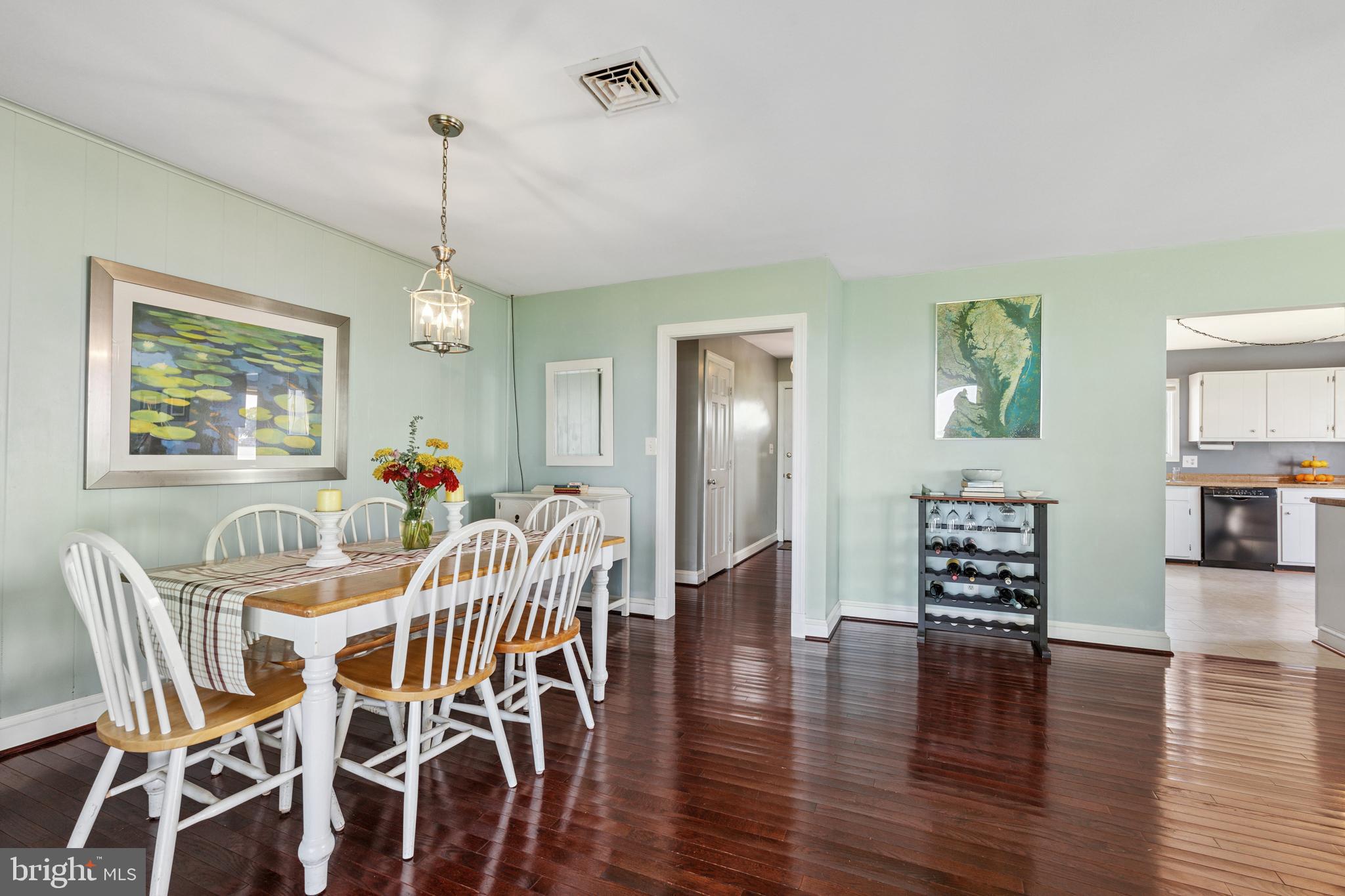 2554 Hoopers Island Road Fishing Creek, MD 21634 - Photo 24 of 85 a view of a dining room with furniture and wooden floor