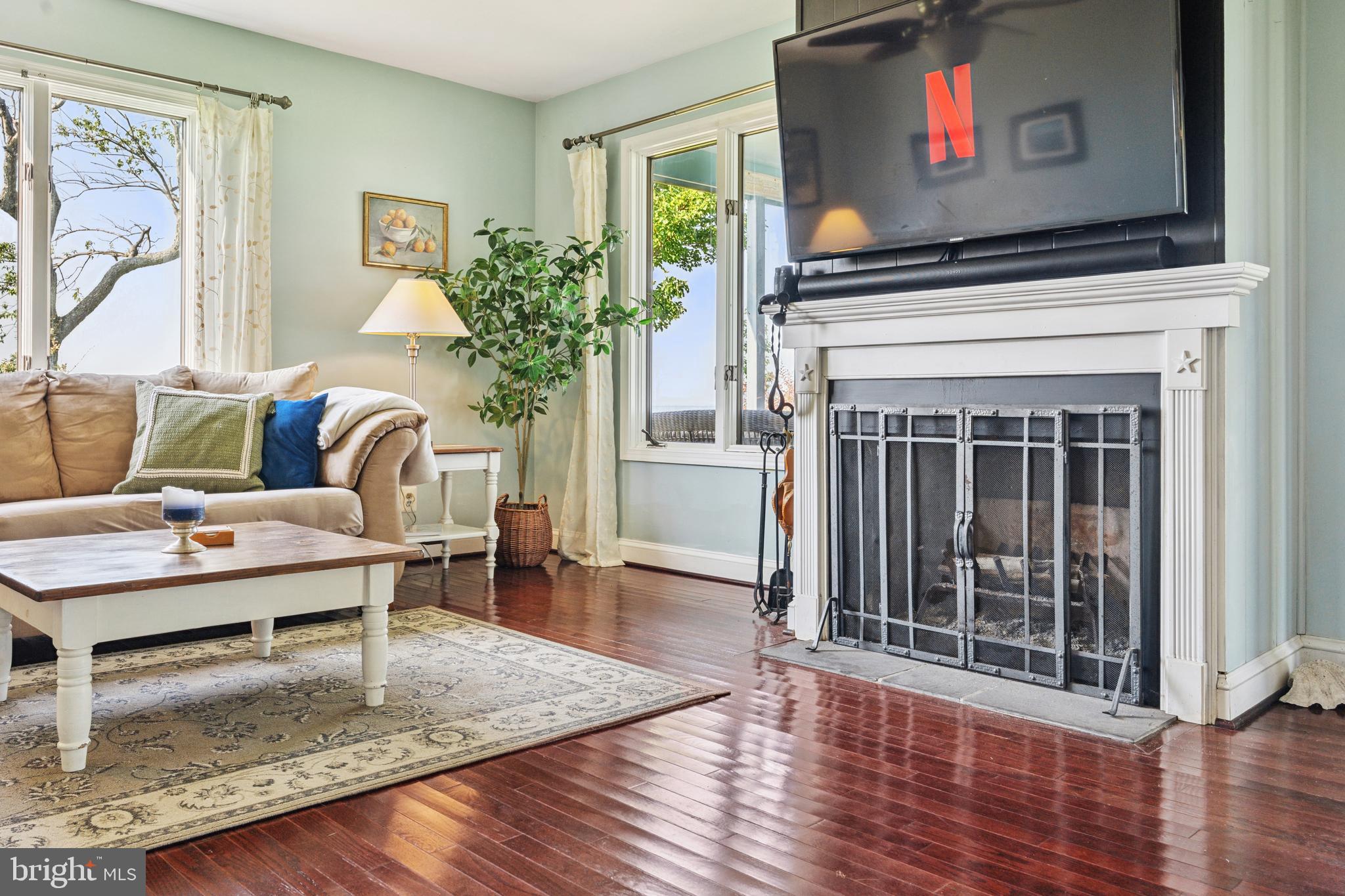 2554 Hoopers Island Road Fishing Creek, MD 21634 - Photo 25 of 85 a living room with furniture and a fireplace