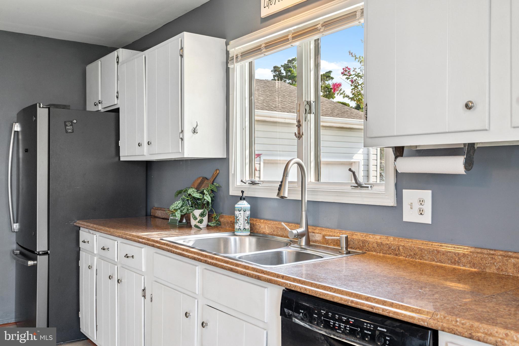2554 Hoopers Island Road Fishing Creek, MD 21634 - Photo 29 of 85 a kitchen with stainless steel appliances granite countertop a sink and a cabinets