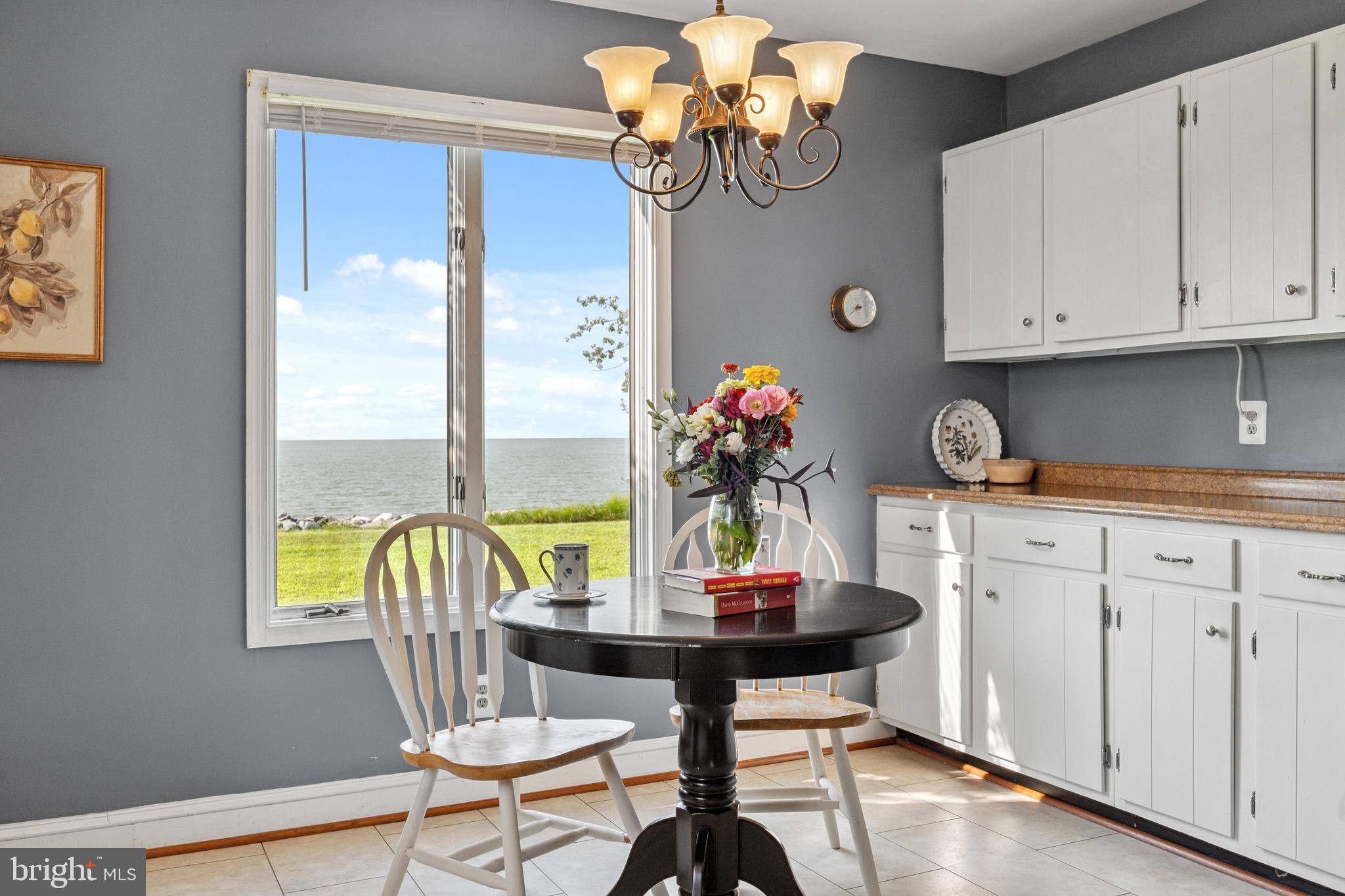 2554 Hoopers Island Road Fishing Creek, MD 21634 - Photo 30 of 85 a view of a dining room with furniture and chandelier